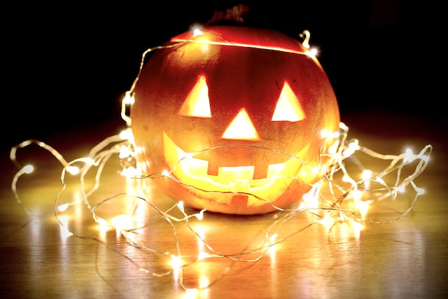 Glowing decorative pumpkin on the floor