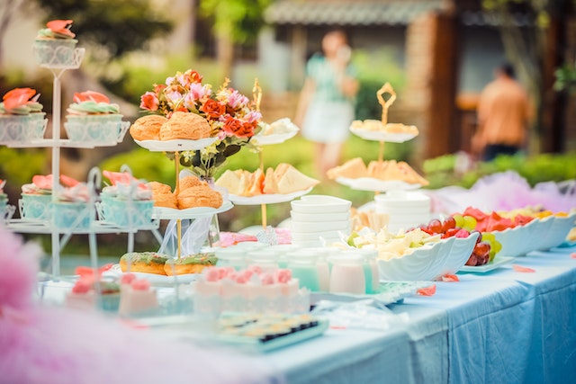 A table full of finger food and desserts.  
