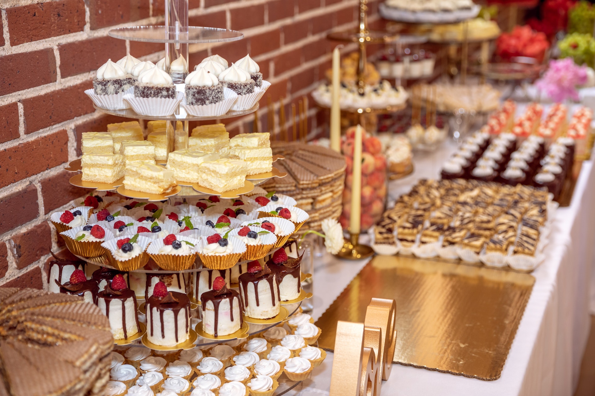 Dessert table with a variety of cakes.