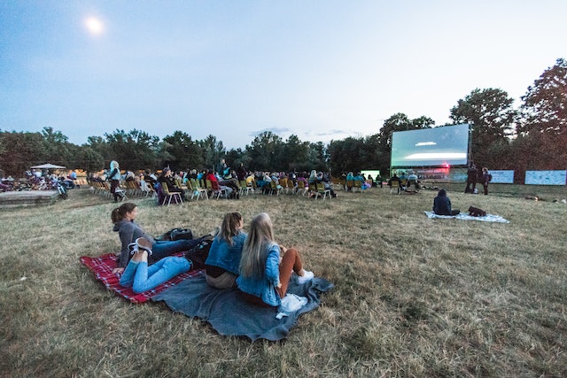 People sitting on the grass.