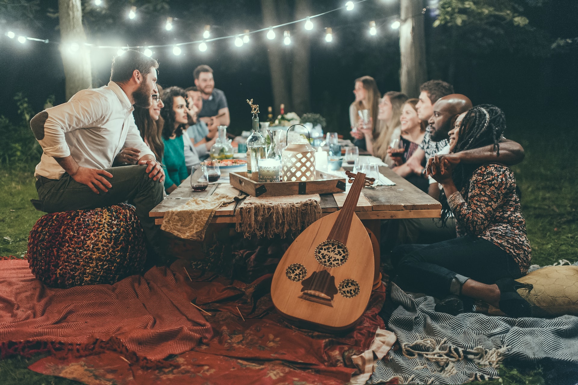 People sitting at the table having dinner.