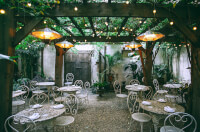An outdoor venue with plenty of seating options and natural elements
