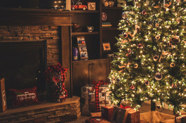 Christmas tree in the room with presents under it