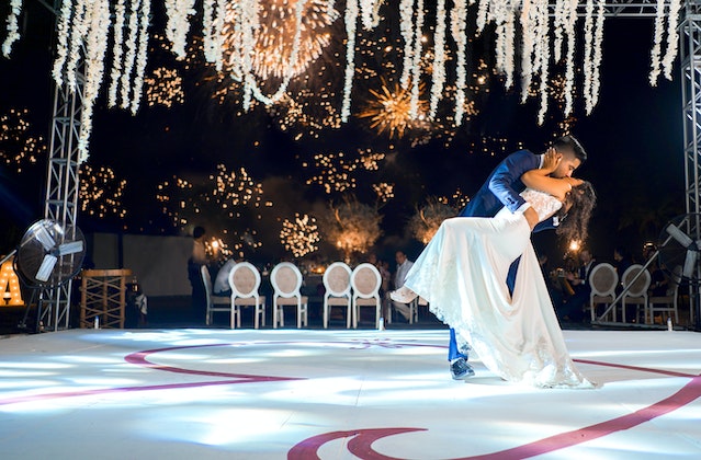 A bride and a groom dancing on the dance floor