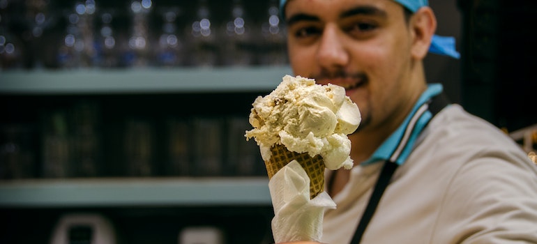 Person handing out ice cream.